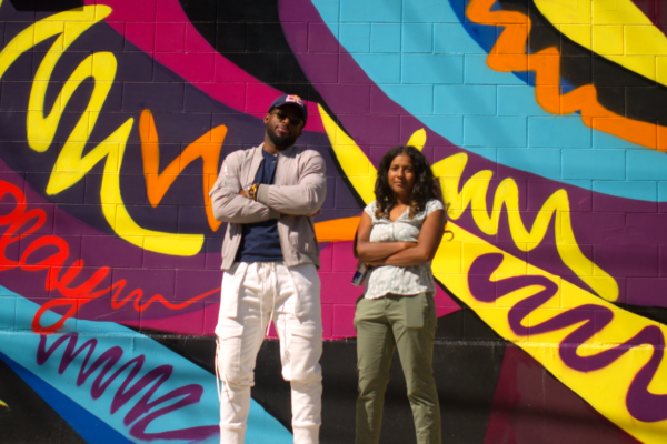 P.k. Subban and Yasmin pose heroically in front of the mural