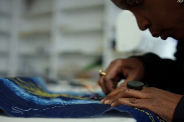 Artist sewing at Project for Empty Space