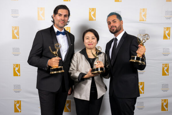 Producer: Igor Alves, Conductor: Xian Zhang, Director: Yuri Alves holding Emmy
