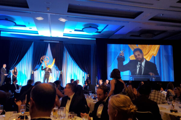 Director, Yuri Alves accepting the Emmy award for emerge and grind