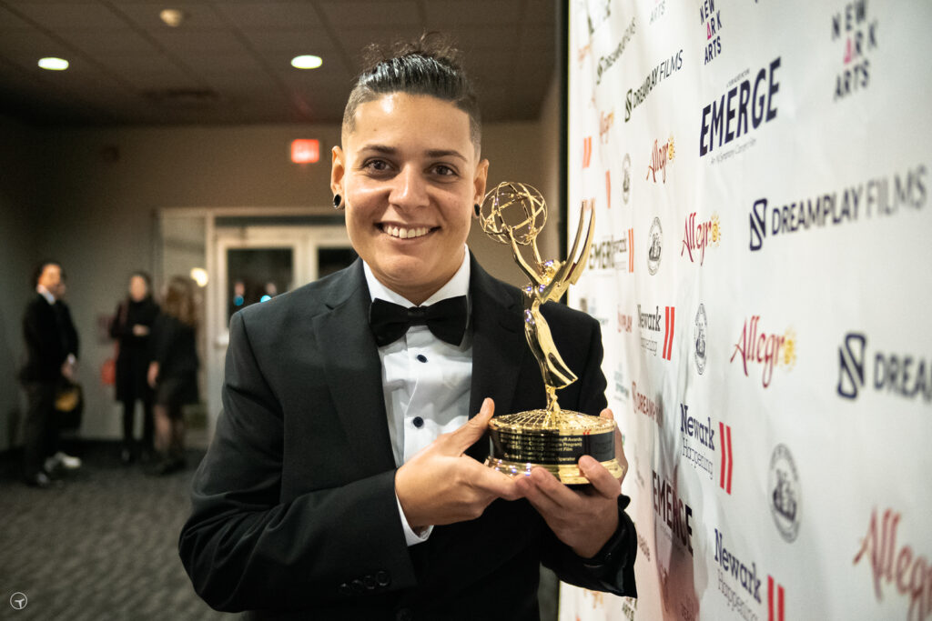 DreamPlay crew member Caroline Sincaruk with her Emmy® Award for EMERGE