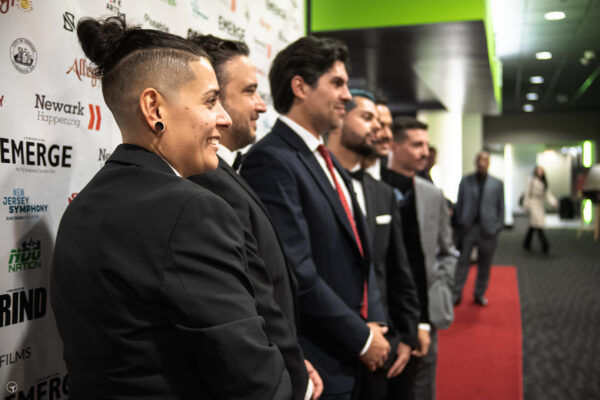 Profile view at step and repeat with the EMERGE crew