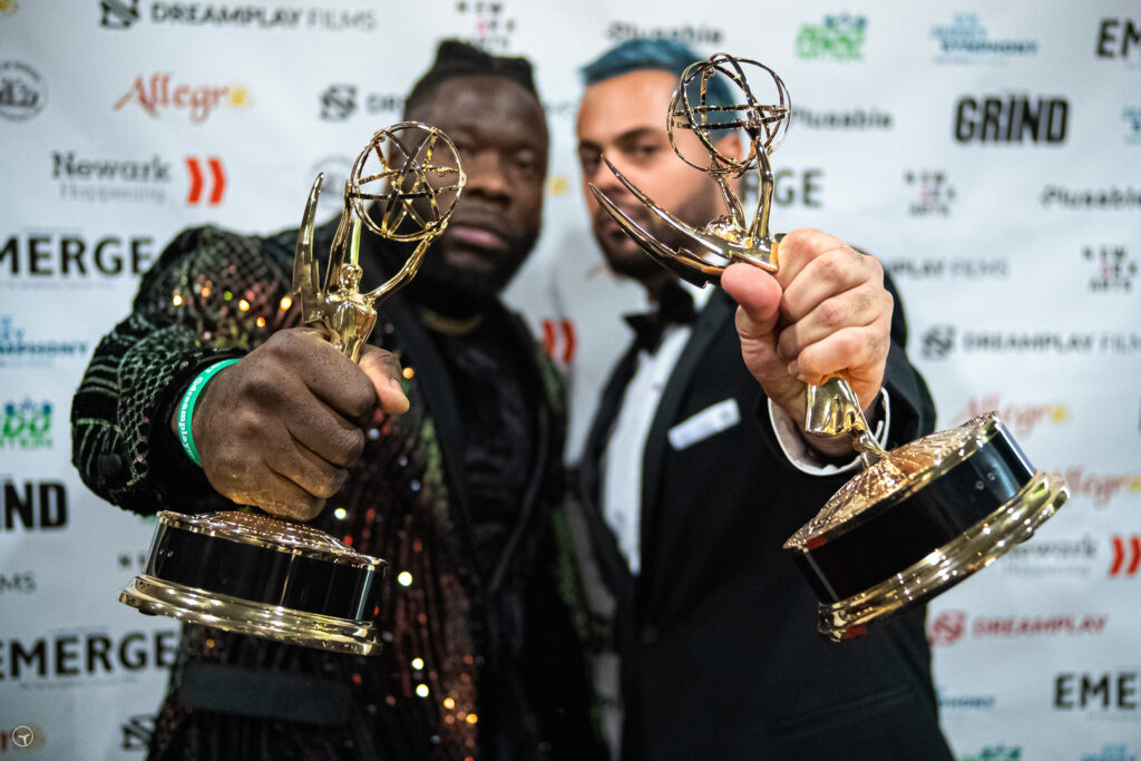 Grind star Robert Willmote and dir. Yuri Alves holding Emmys® to camera