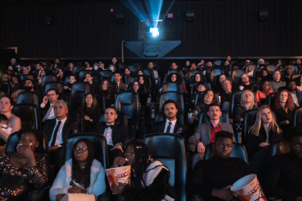 EMERGE + GRIND screening audience watching the presentation