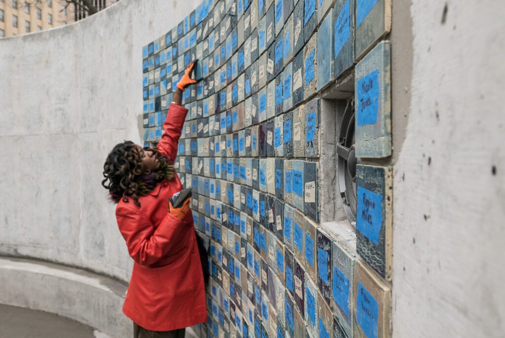 Harriet-Tubman-Monument_DreamPlay_Cesar-Melgar-2790822_select-2800397_selects ADEBUNMI GBADEBO placing a tile on the wall