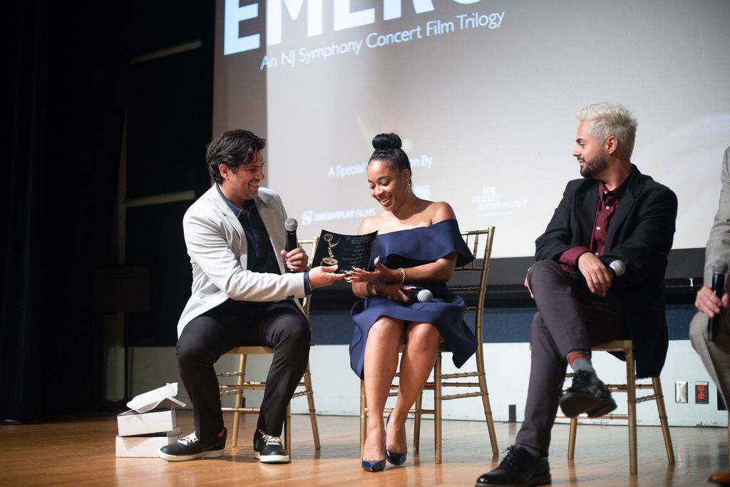 Producer Igor Alves presenting Cori Barnes a plaque recognizong her role in the Emmy Award winning film EMERGE