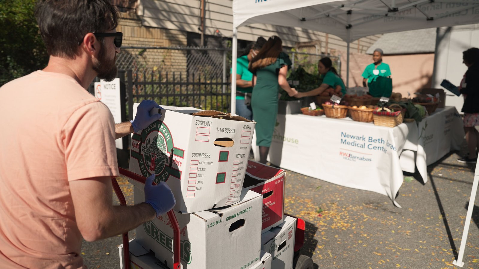 Emilio bring greens to Newark Beth Israel Medical Center's farmers market.