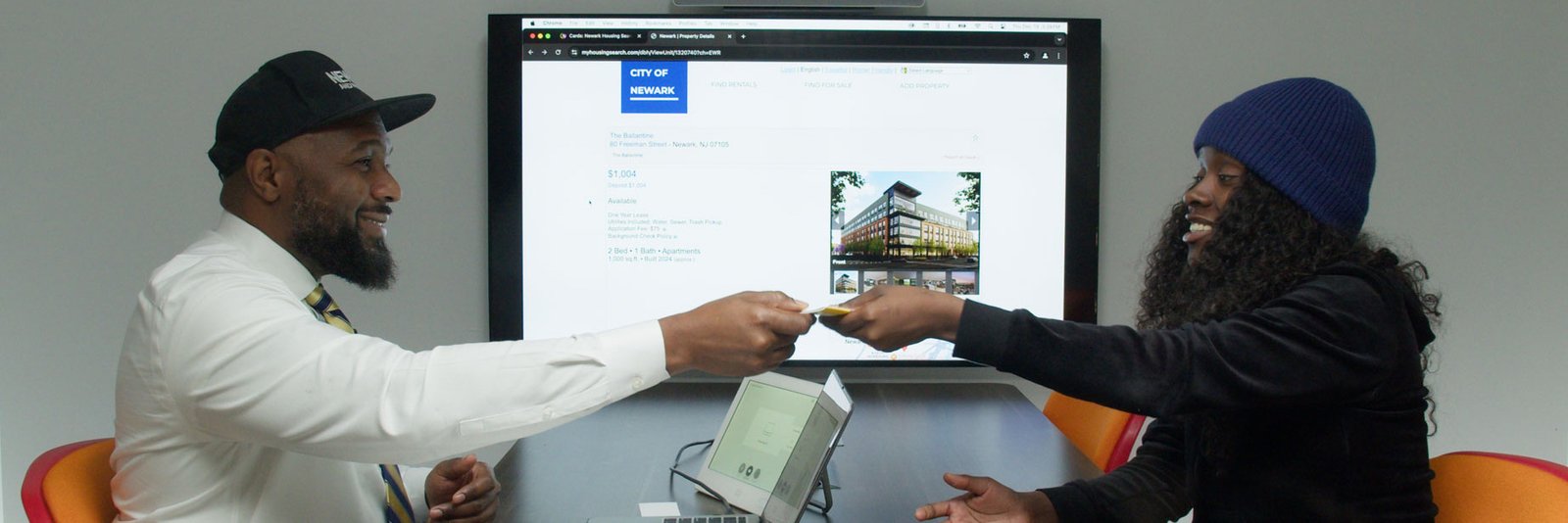 Taquan handing information to client