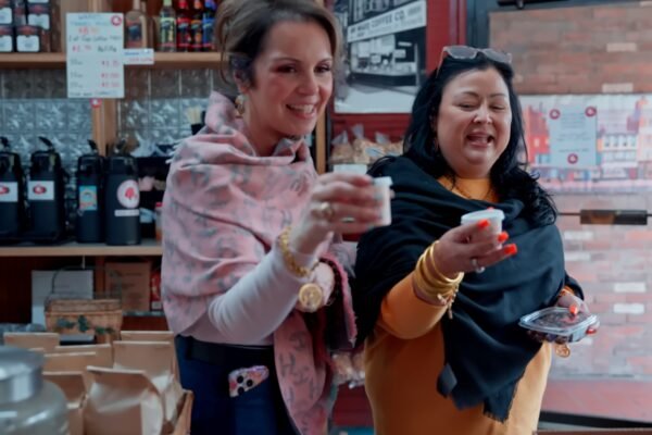 Carrie grabbing coffee with a co-worker