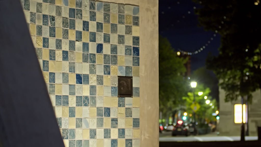 Speaker at the monument tile wall